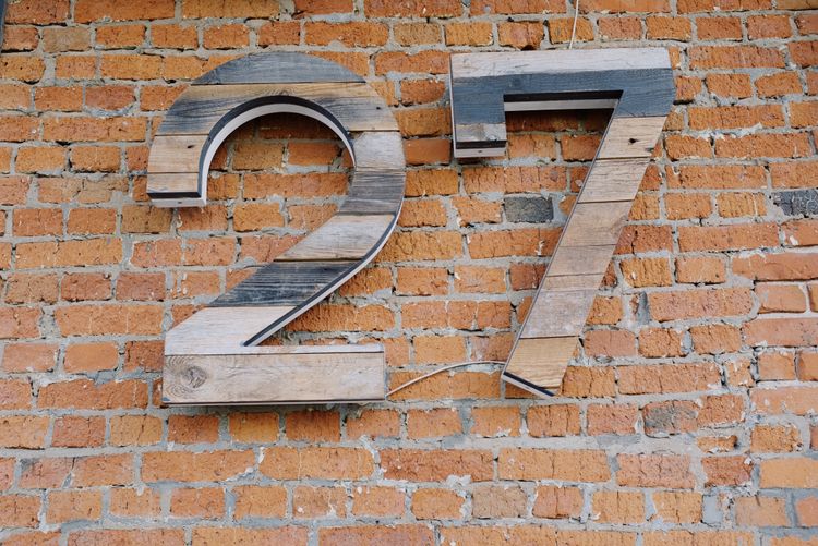 "27" on a brick wall