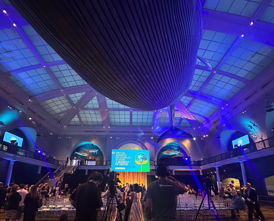 American Museum of Natural History whale room while a speech gets set up on stage